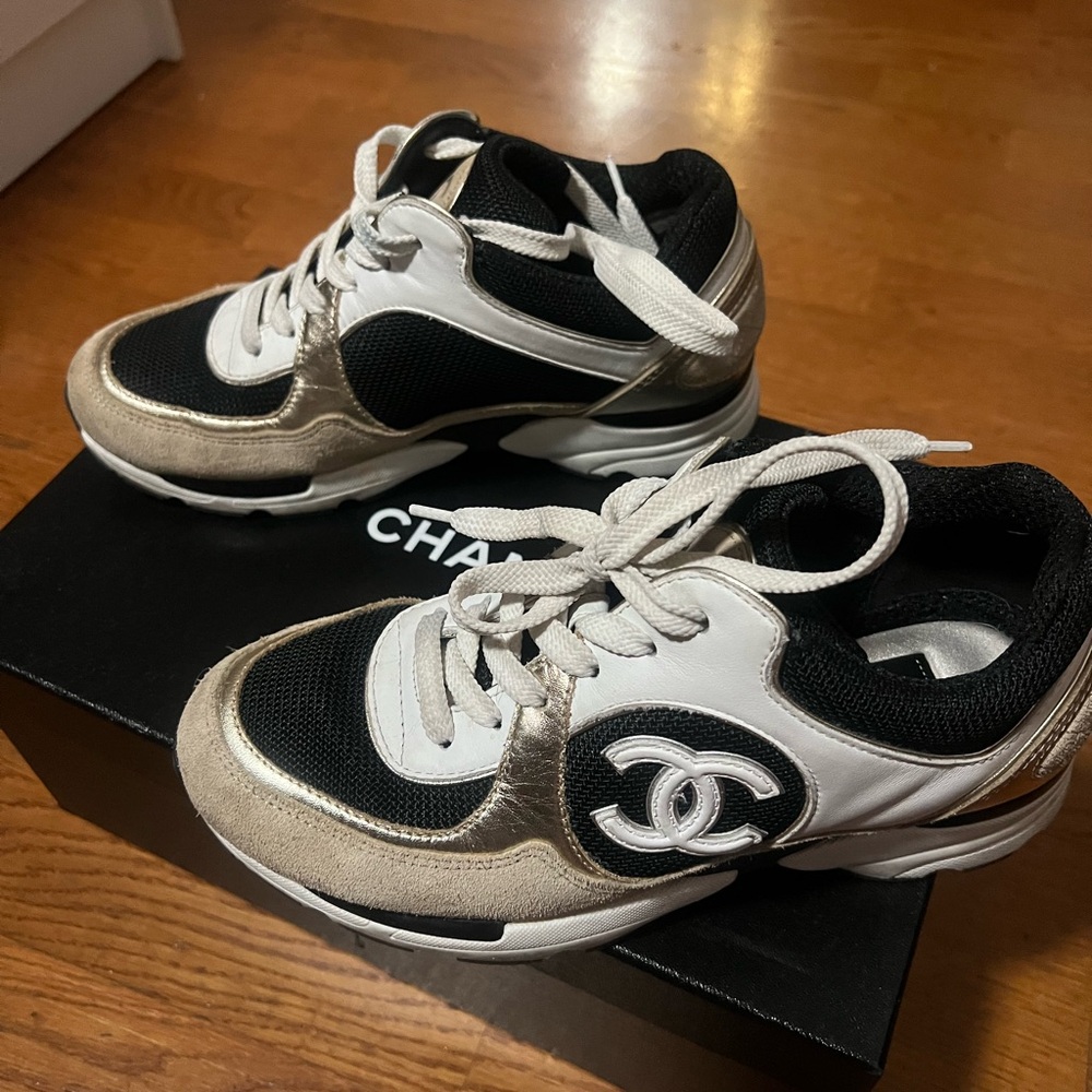 CHANEL Black, White, and Gold Sneakers